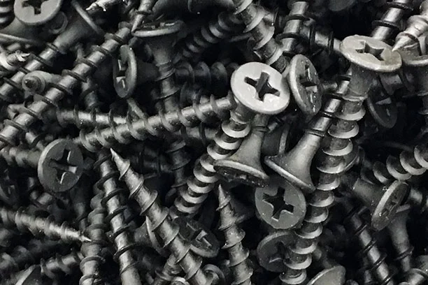 A pile of screws that fill the whole image