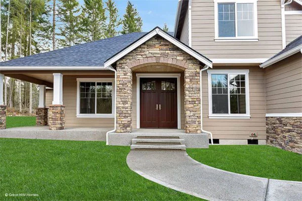 Beige house with stone front and dark brown double wooden doors