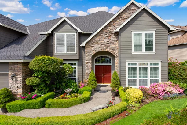 House with low hedges lining walkway