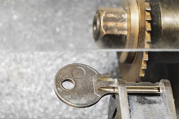 Close-up of a key being cut