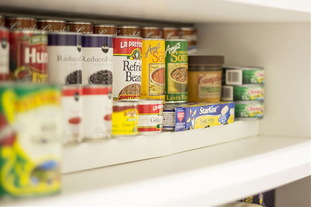 Canned goods on a pantry shelf