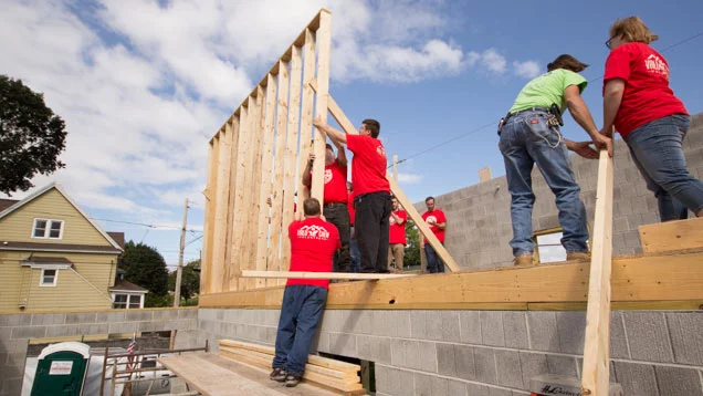 Valu volunteers helping work on a home for a local family in need