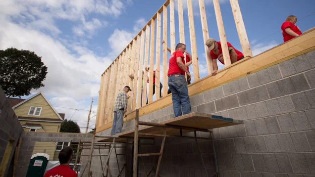 Valu volunteers helping work on a home for a local family in need