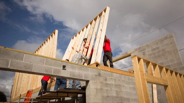 Valu volunteers helping work on a home for a local family in need