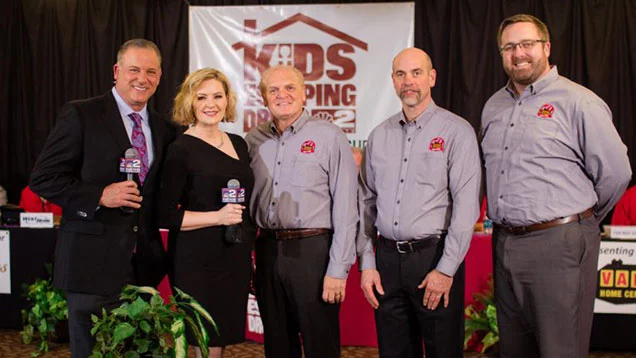 Valu crew standing with news reporters from WGRZ – Channel 2