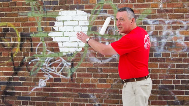 John Andrijczuk demonstrating how to paint exterior surfaces