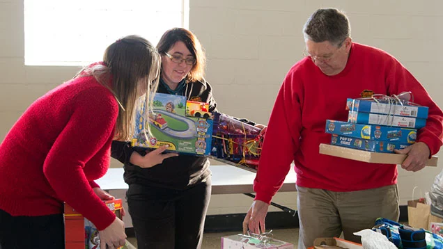 Valu team members organizing a boxing toys being donated