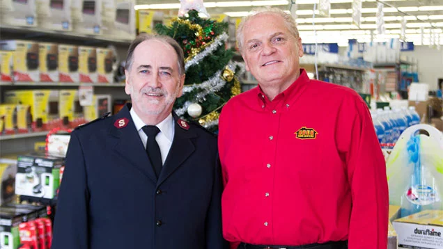 Michael Ervolina from Valu standing with The Salvation Army representative