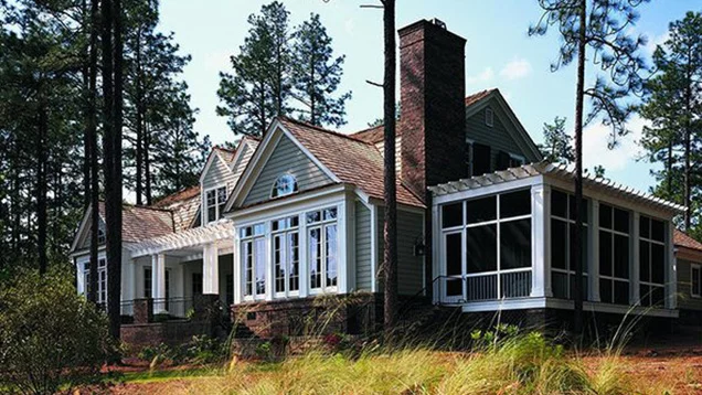 house in the woods with anderson windows