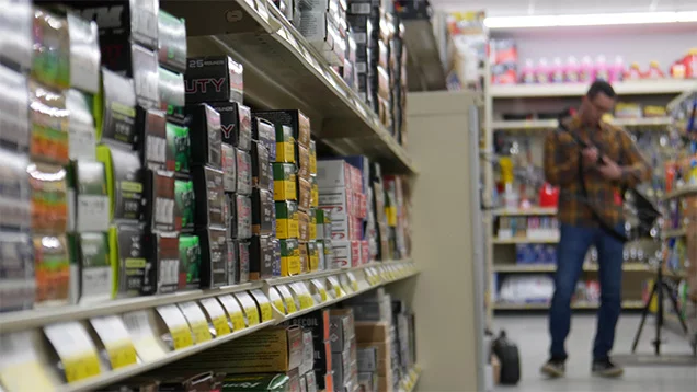 Ammo on shelves and customer in background
