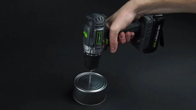 Drilling a hole in the center of tuna can