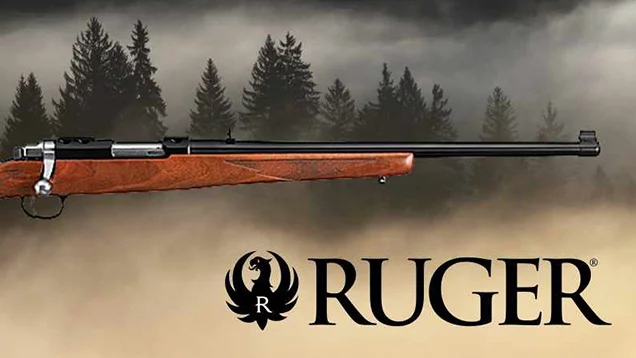 Ruger rifle with pine tree background