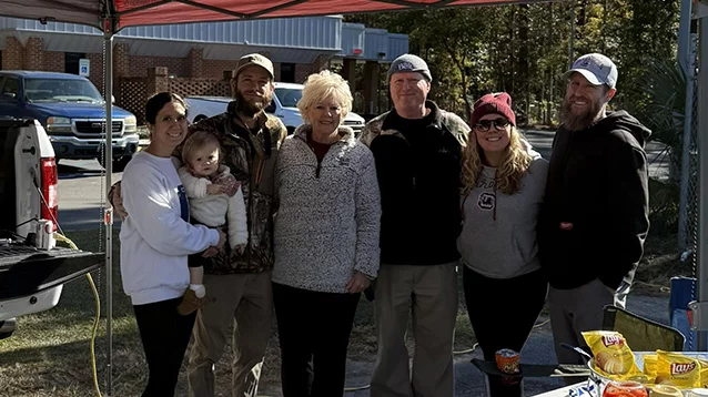 moody family and wives at tailgate