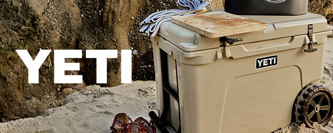 Yeti logo on the left hand side with a lifestyle of a hard yeti cooler