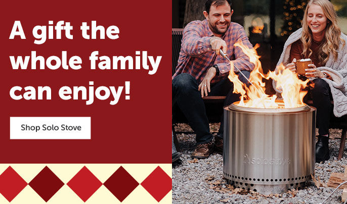 Text left - "A gift the whole family can enjoy!" Shop Solo Stove button. Image right -  A group of young adults sitting around a solo stove smokeless firepit in fall