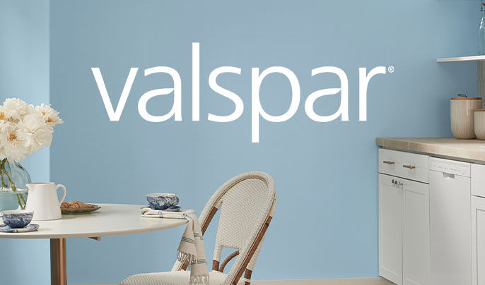 Valspar Logo with a teal living room in the background