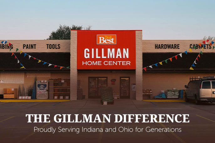 Gillman Home Center store front. The building is tan with black awnings and in the center above the double entrance doors is a sign that says "Gillman Home Center"