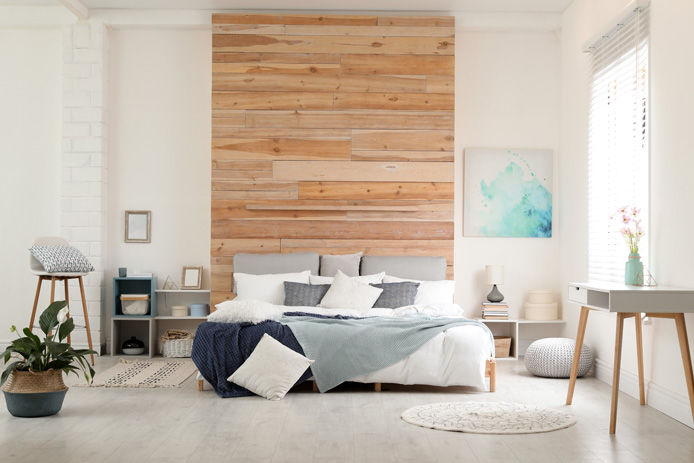 bedroom with wood headboard on wall
