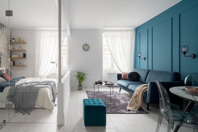 living room with glass wall and blue wall