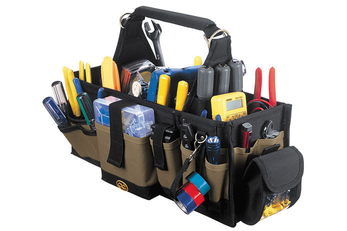 A black tool bag filled with hand tools 