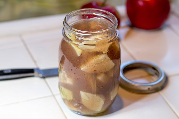 Canned apples on a countertop