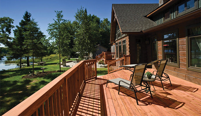 View of a deck and roof of a home