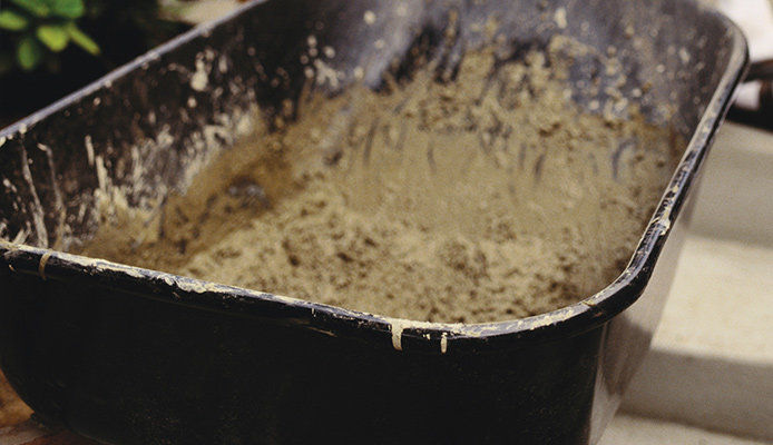 Wheelbarrow full of mud