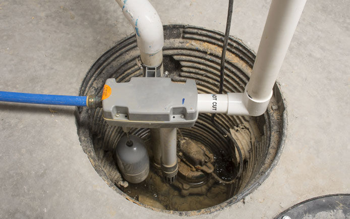 Overhead visual of a sump pump in a basement