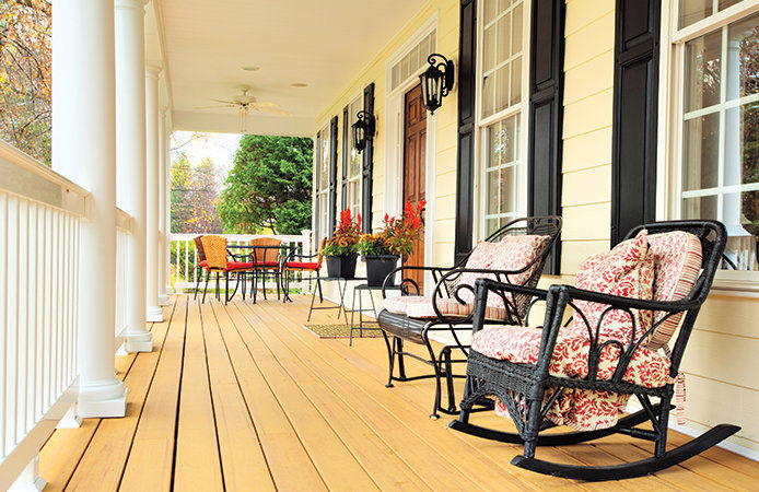 Front porch with patio furniture and plants