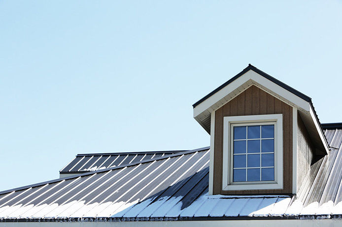 A snowy roof of a home