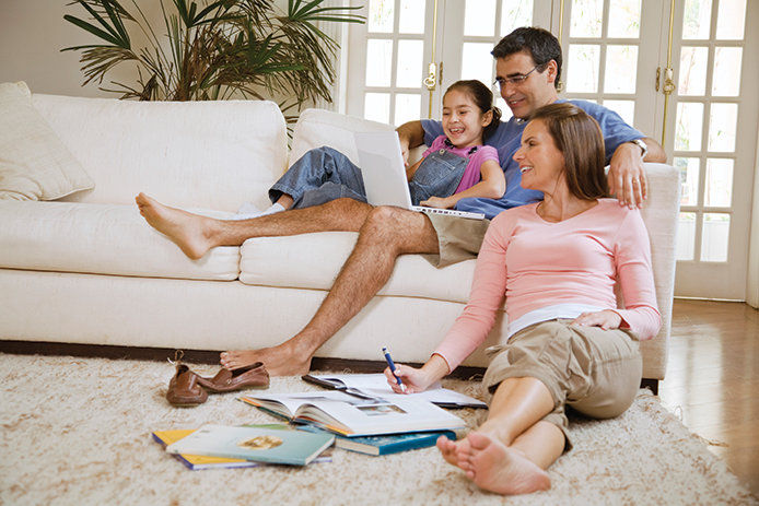 A family sitting in a living room