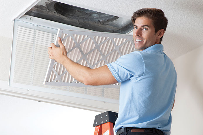 Man replacing air filter