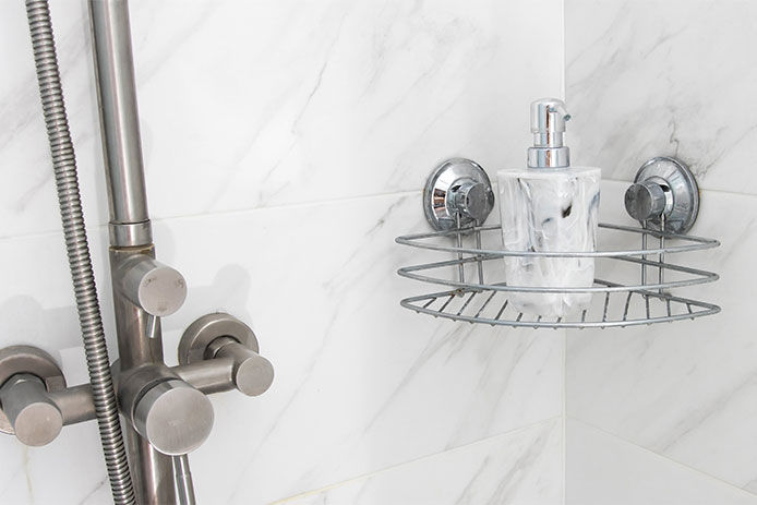 Suction cup basket hanging on a shower wall