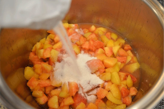 Chopped peaches in a canner