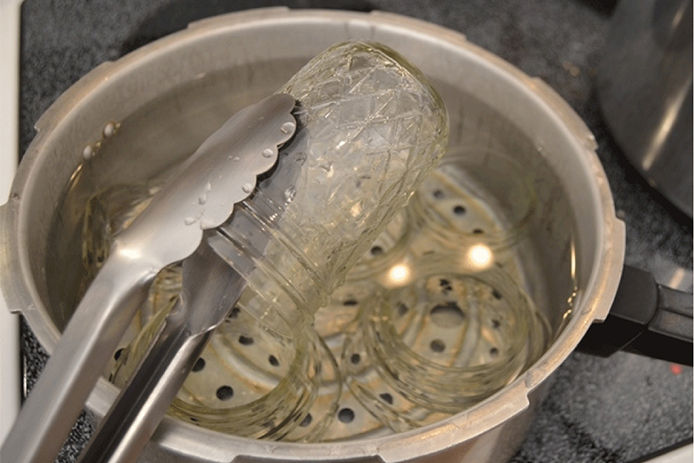 Picking up jars with tongs