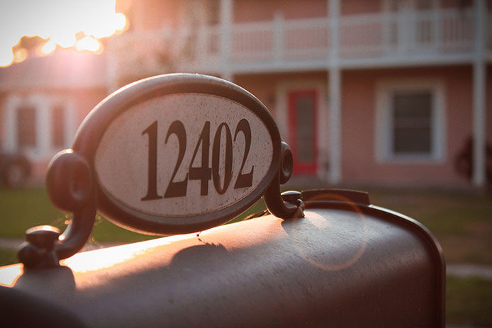 Address number plate on top of a mailbox