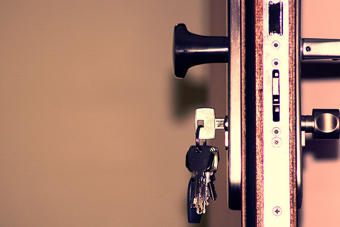 Keys inserted into a lock on a door