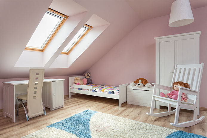 A pink themed childerns bedroom