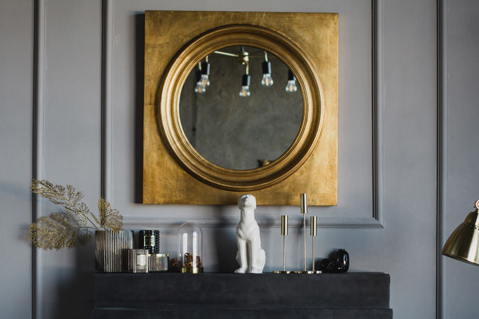 fireplace with mirror above the mantel