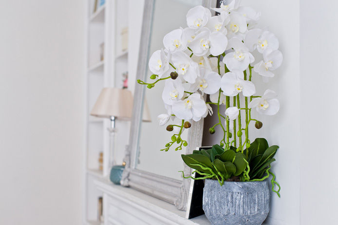 fireplace mantel with orchid decor
