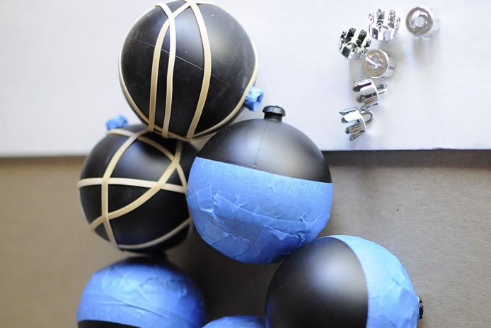 holiday ornaments taped with masking tape for marking