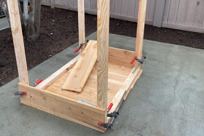 clamps holding wood for planter