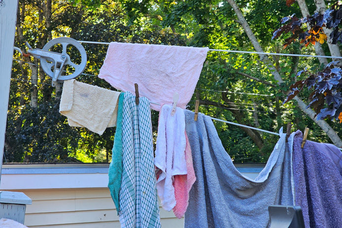 clothes on clip drying on a pulley clothesline