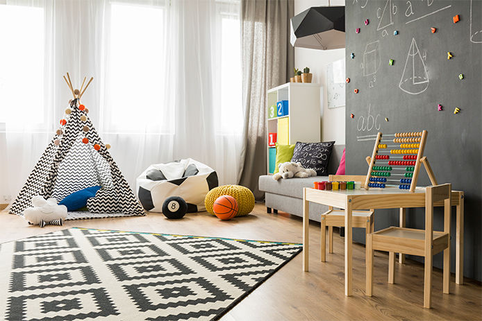 A kids bedroom that includes many patterns