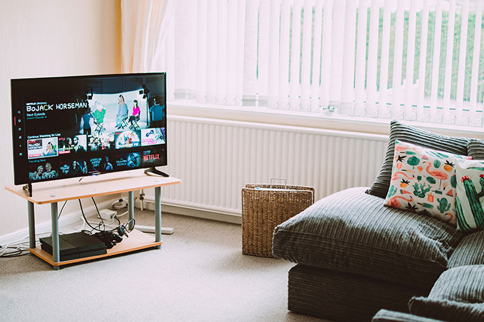 A living room with a couch and TV