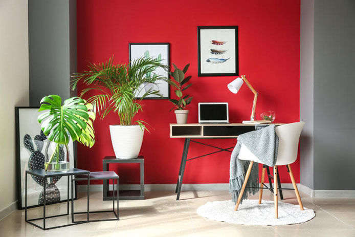 Red accent wall in home office