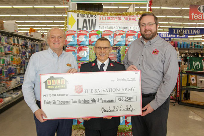 Holding the check that was presented to The Salvation Army