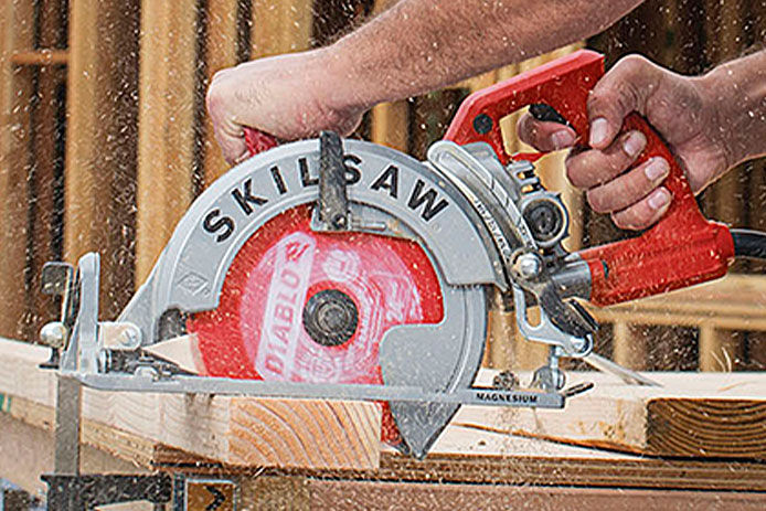 A close up of a SKILSAW circular saw being used on the jobsite