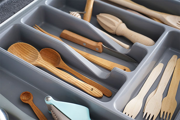 Kitchen utensils in a plastic organizer