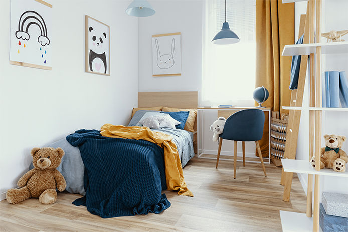 A blue and yellow childrens bedroom